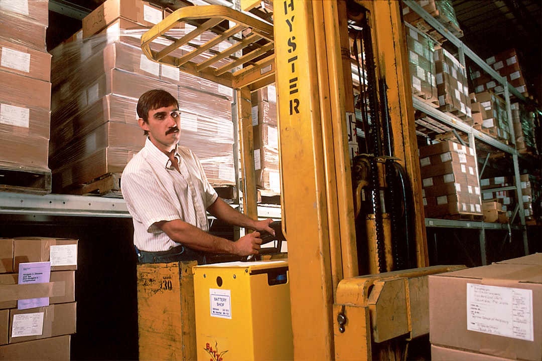 person operating yellow forklift