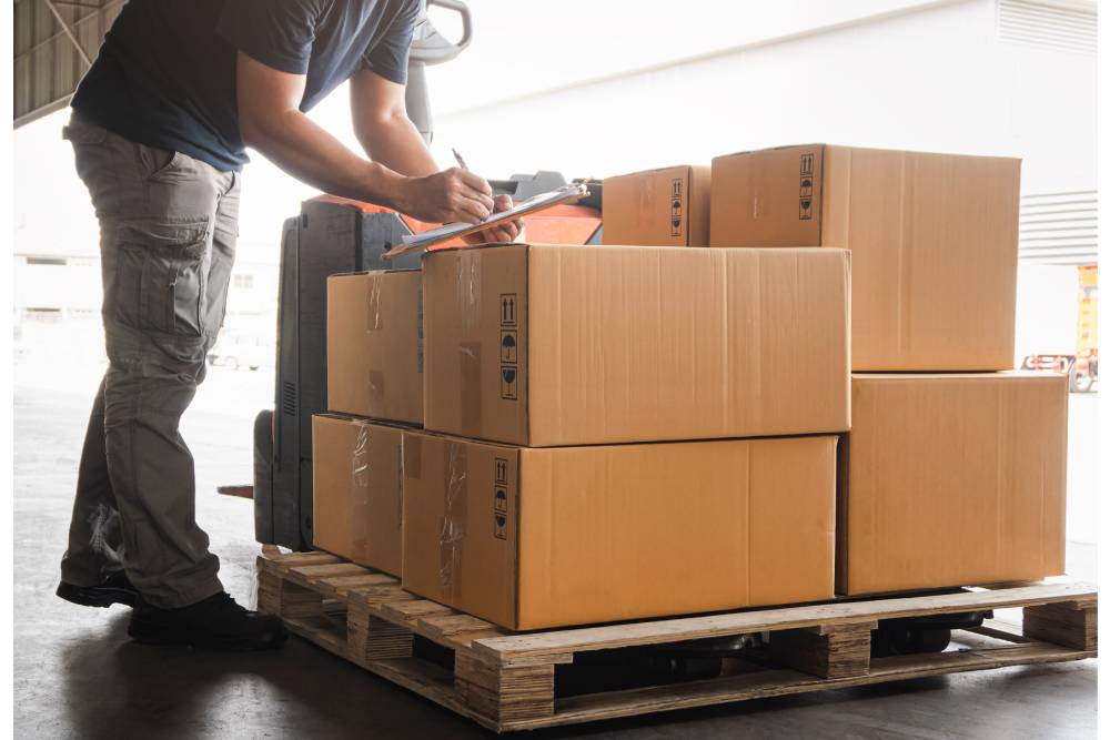 man checking inventory in warehouse